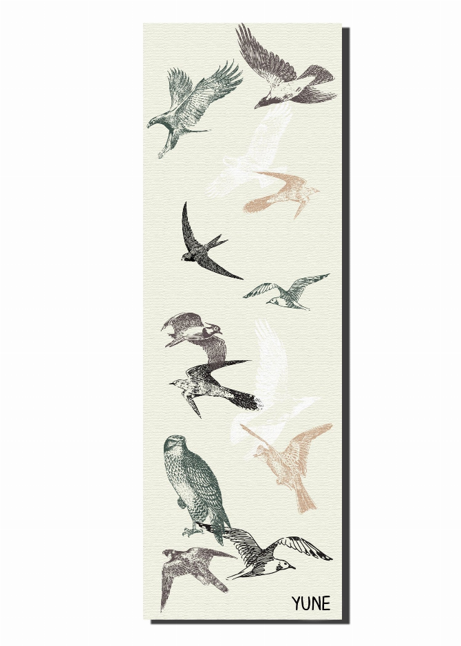 Cream yoga mat with full bird illustration pattern and YUNE logo at bottom