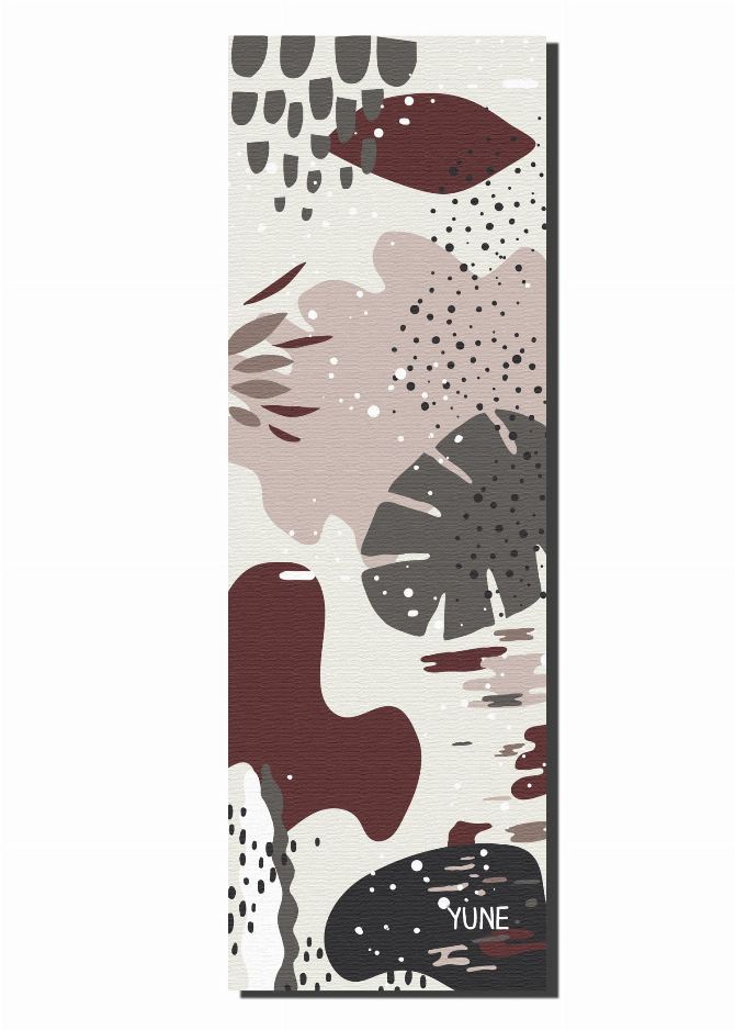 Yoga mat with abstract maroon, cream, and dark jungle-style print, unrolled