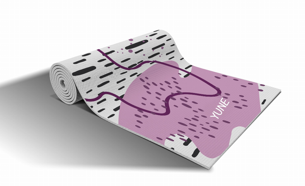 Rolled yoga mat with abstract purple rock print and black line pattern