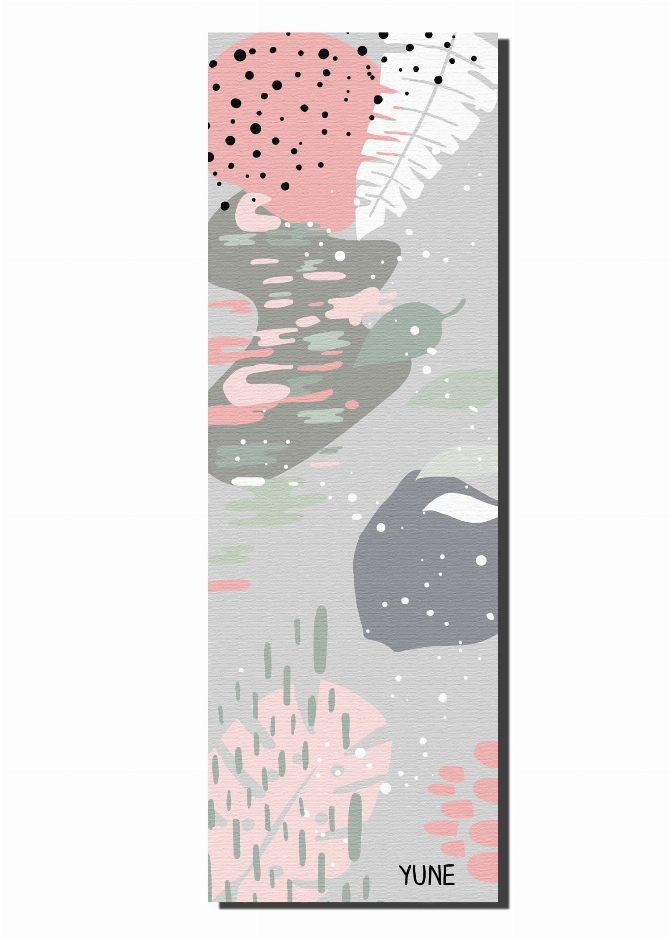 Yoga mat with gray and pink cactus pattern, laid flat