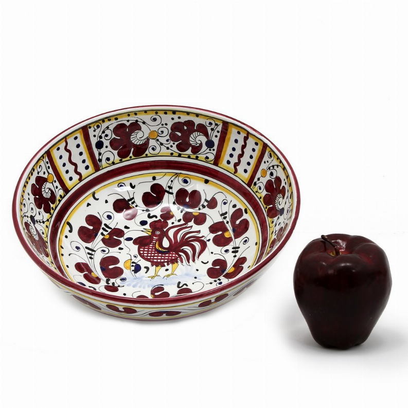 Red rooster ceramic serving bowl with decorative hearts; dark red rooster ornament beside it