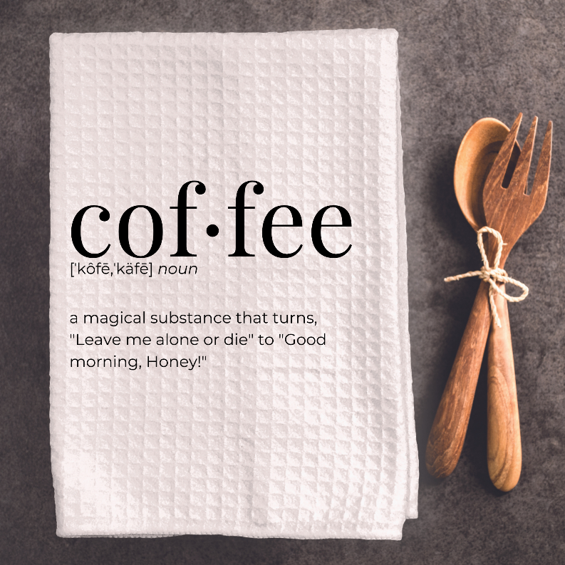 Folded white tea towel with coffee word and definition quote, waffle weave pattern