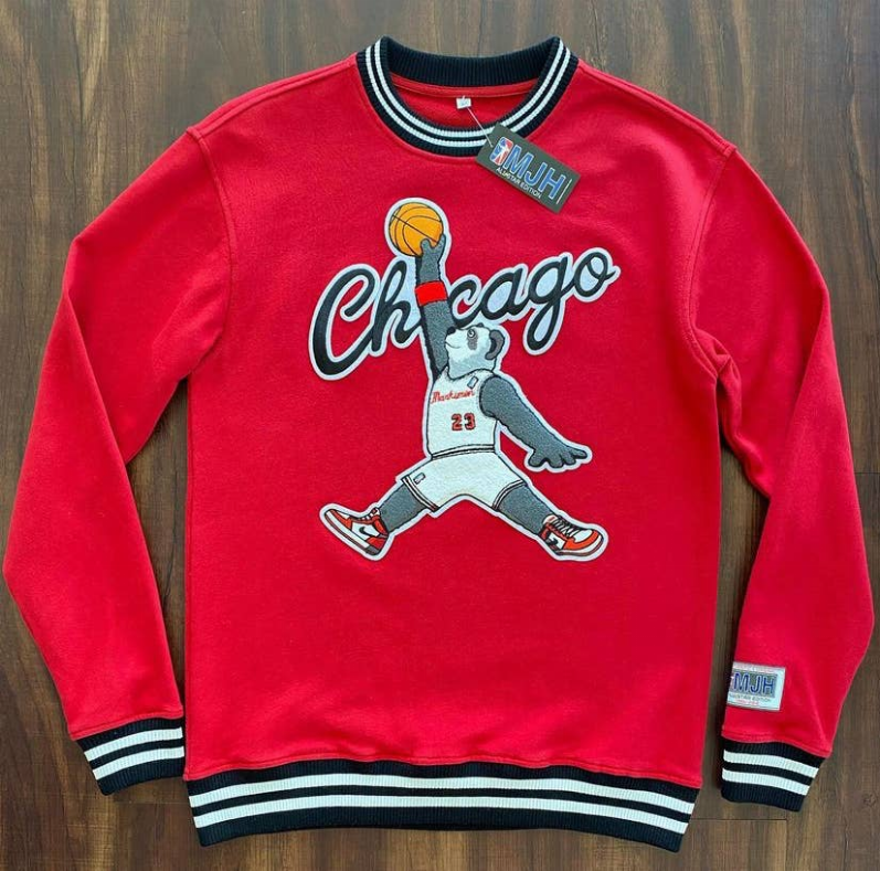 Red sweatshirt with Chicago script basketball player graphic; striped rib cuffs