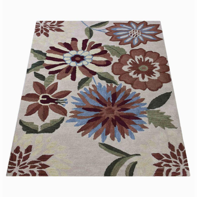 Hand-tufted shag area rug featuring blue, brown, and red blossoms on light background