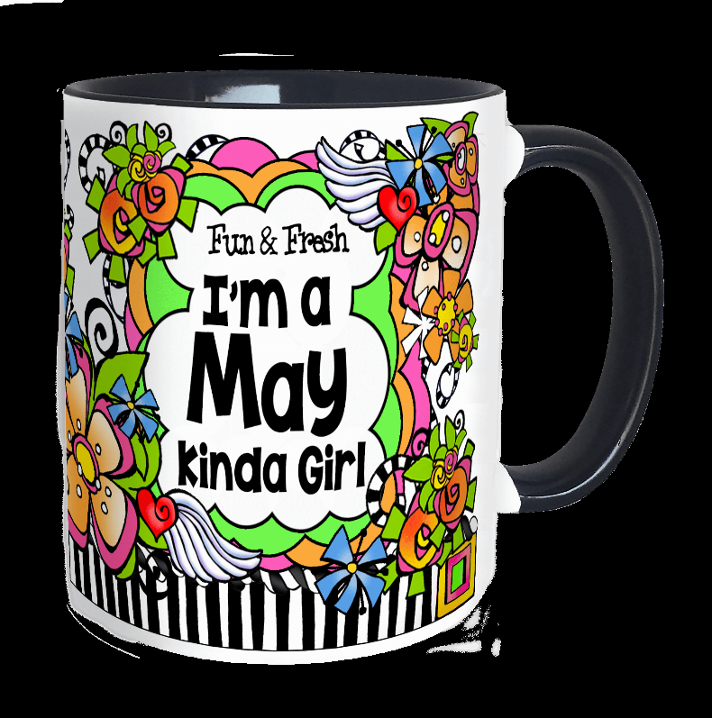 White ceramic mug with dark handle, colorful cartoon flowers and text "I'ma May kinda girl"