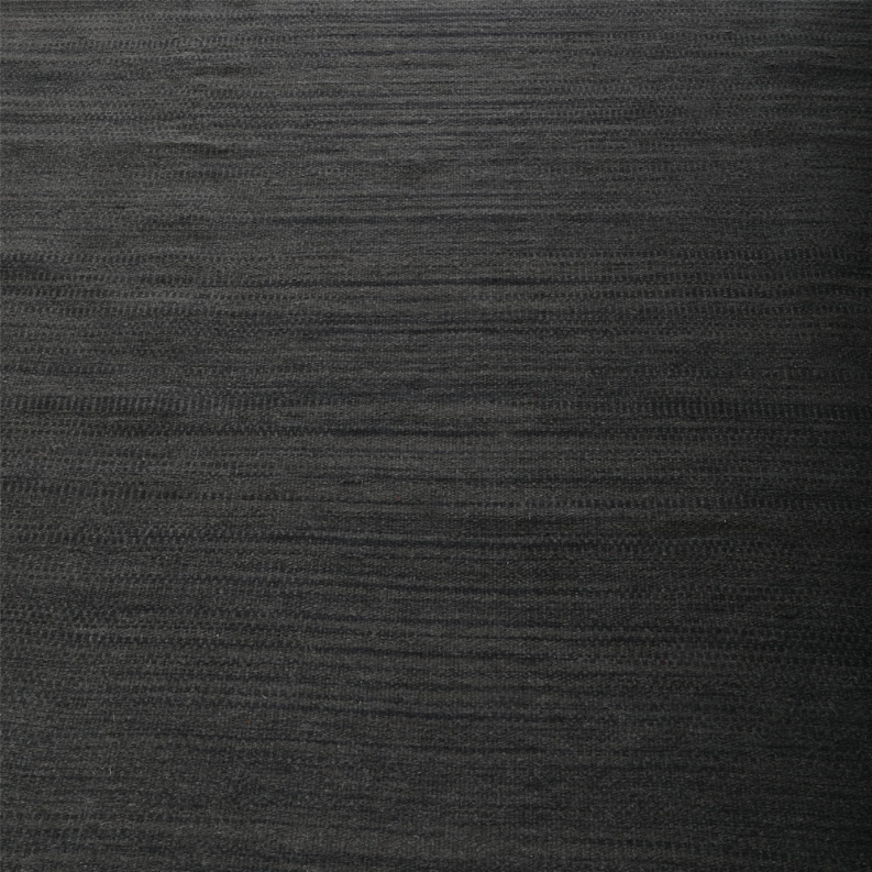 Dark gray flatweave kilim rug face with fine horizontal woven lines