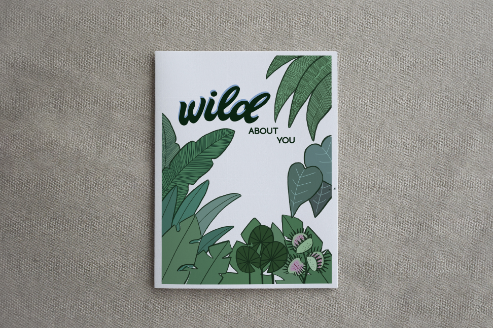 Square botanical greeting card with white border, green leaf art, and "wild ABOUT YOU".