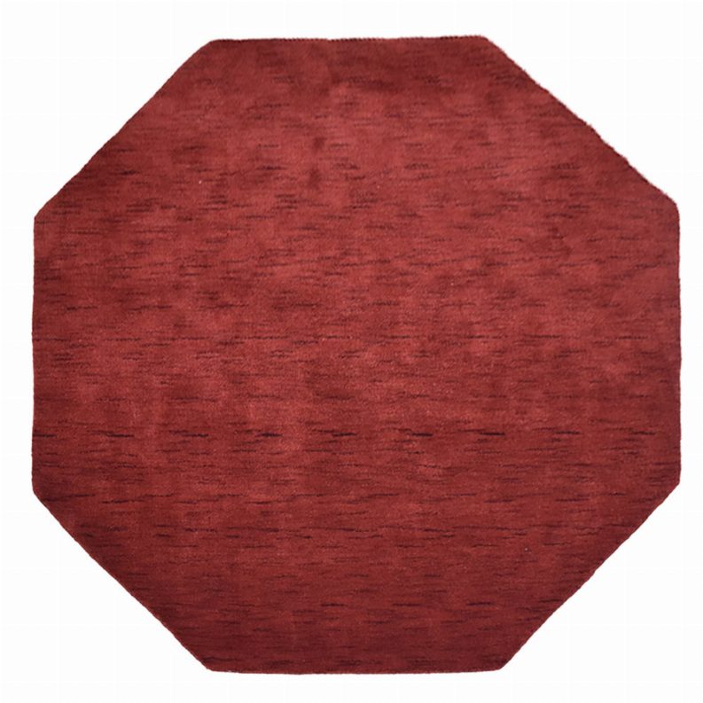 Red octagon area rug with even surface texture and short wool pile