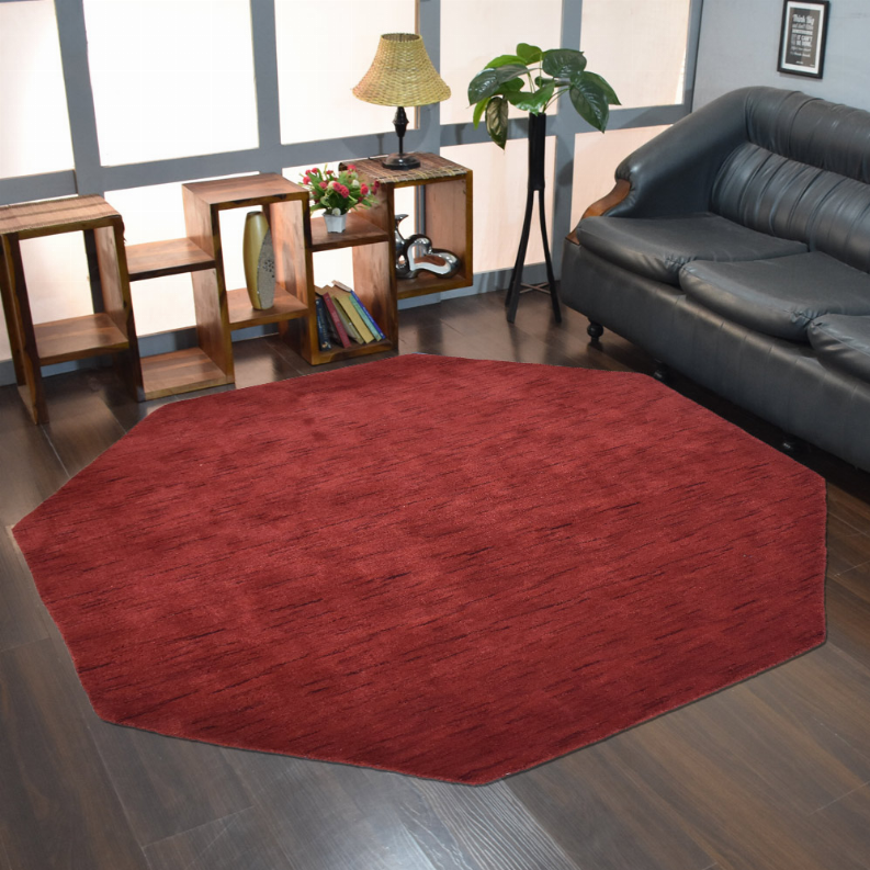 Red octagon area rug in living room setting on hardwood floor