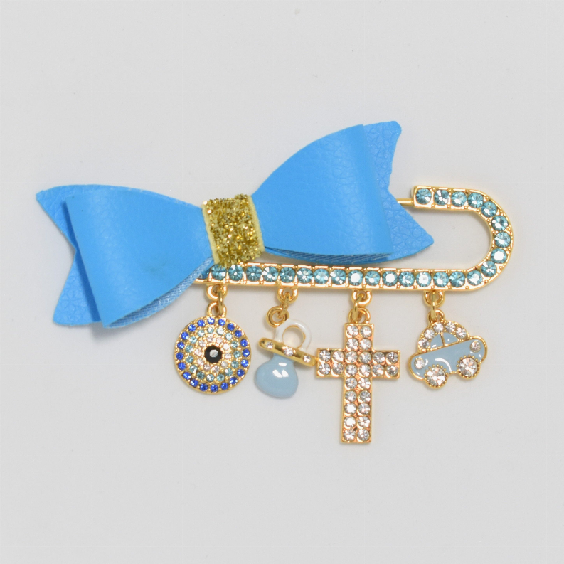 Blue bow hair pin with gold-tone base, rhinestone circle and car charm with cross