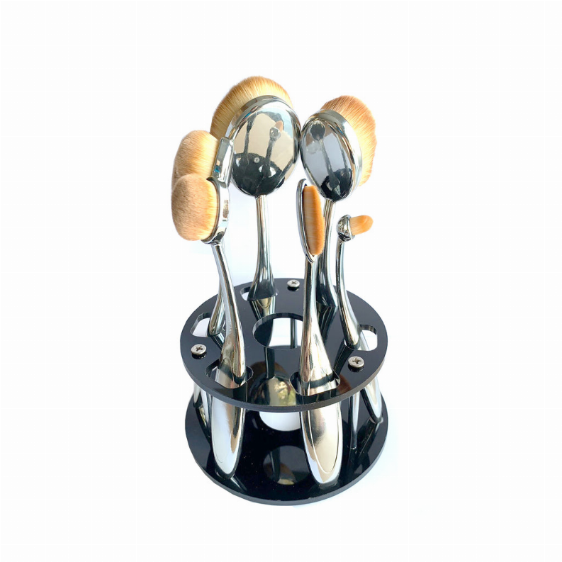 Beauty brush caddy organizer holding six oval brush heads in chrome stand