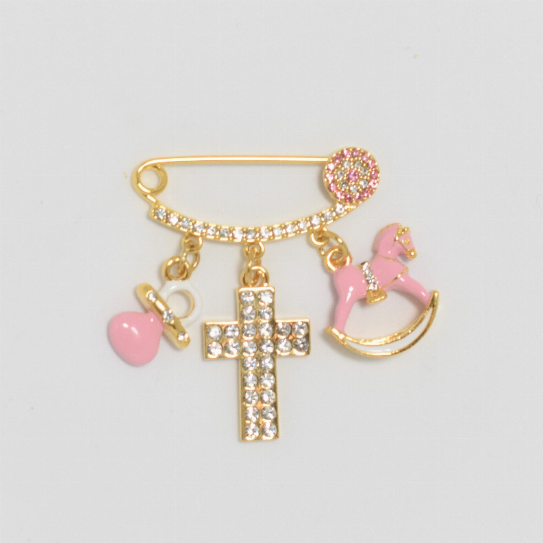 Gold baby safety pin with rhinestone details and dangling pink heart, cross, and rocking horse charms