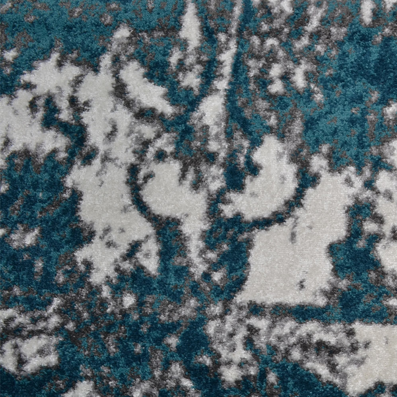 Abstract area rug with teal and blue floral scroll shapes on white background
