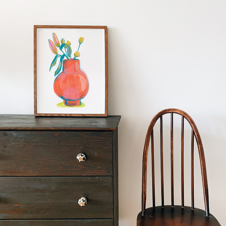 Framed floral still-life print showing orange vase with teal and yellow flowers