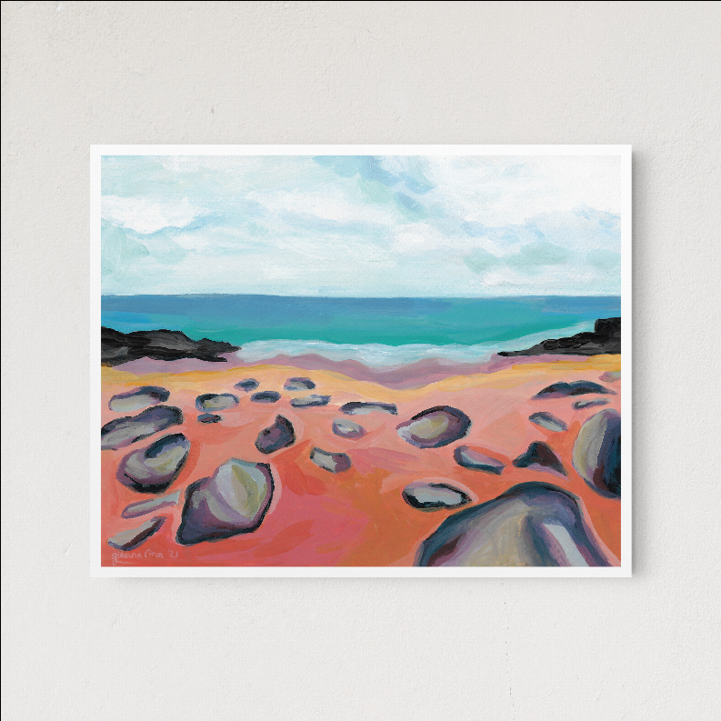 Framed beach artwork print with coral sand, rocks, and turquoise ocean