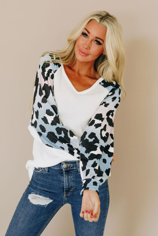 Half Life thermal top with white V-neck front and black-and-white spotted raglan sleeves