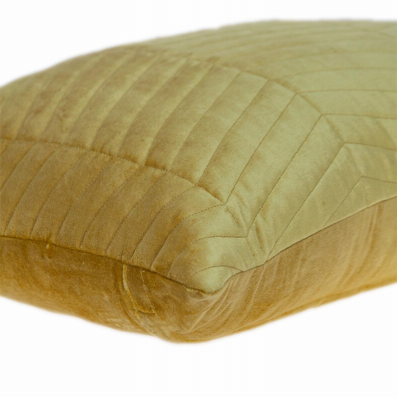 Yellow lumbar throw pillow with channel-quilted texture on the corner