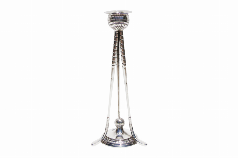 Large silver candlestick with round holder and three-legged base, golf-themed motif