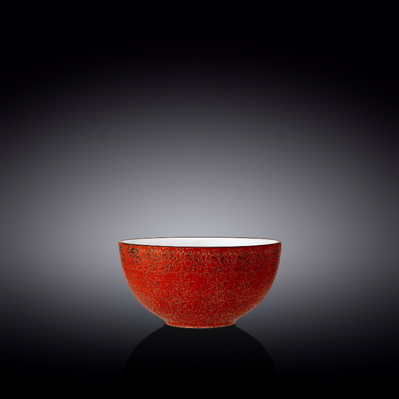 Close-up red speckled ceramic bowl with white interior
