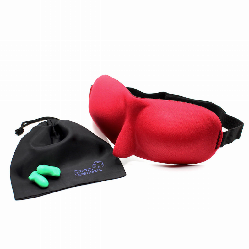 Red satin sleep mask with black strap and Dream Essentials logo on pouch