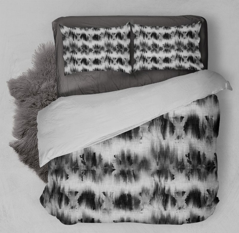 Black-and-white tie-dye duvet cover and two pillow shams, close-up view
