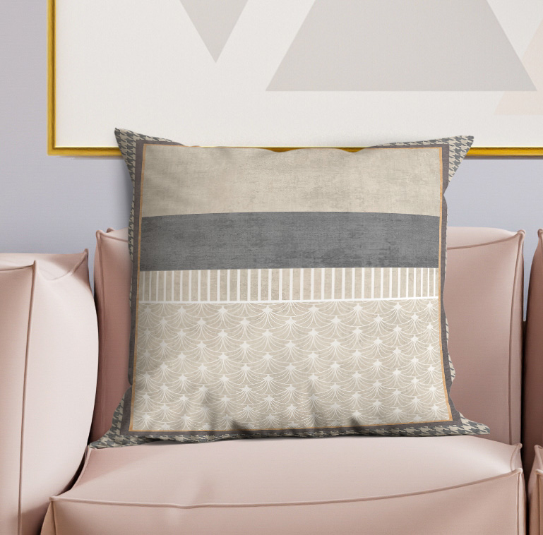 Decorative square pillow with gray horizontal stripe, white lace-like pattern, and trim