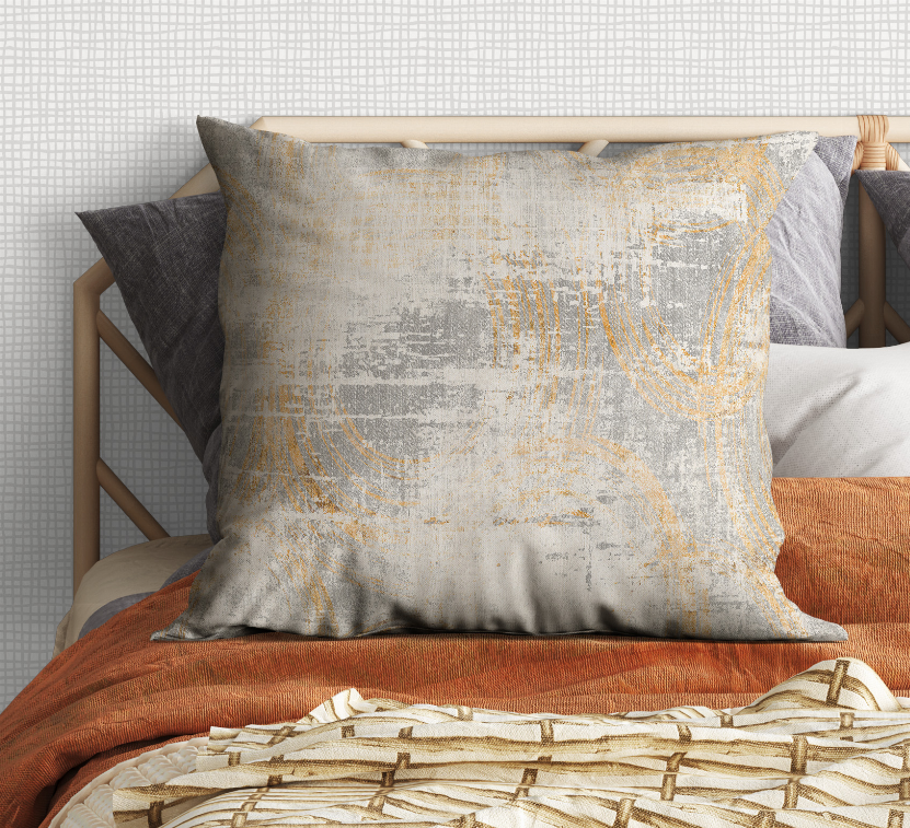 Square pillow with light gray base and gold abstract brush lines, cushioned cover