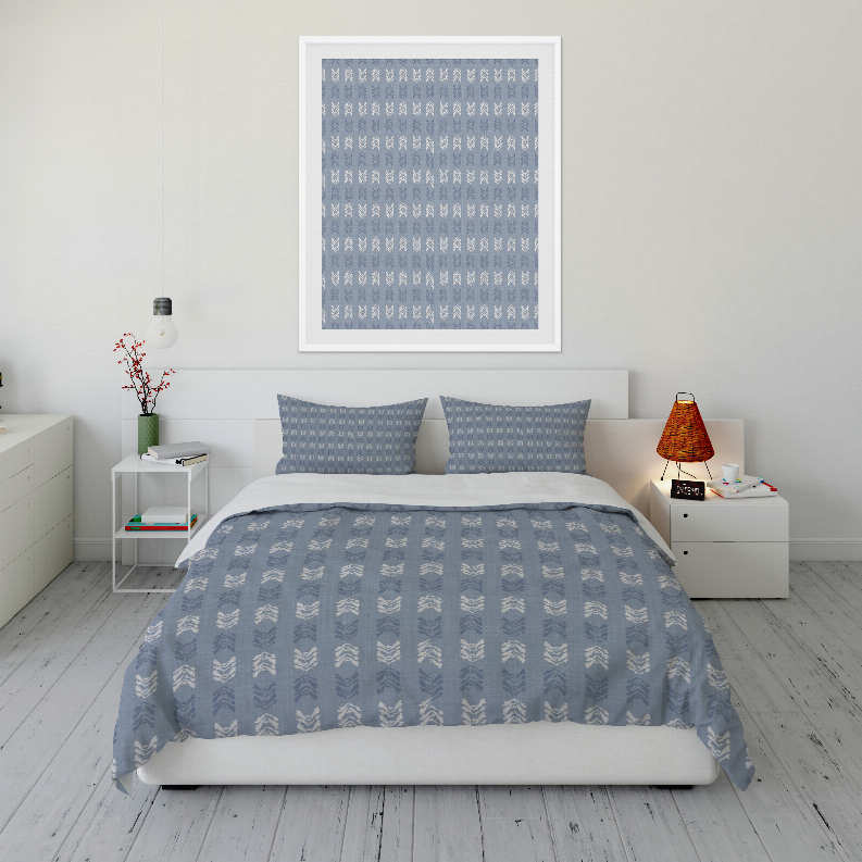 Blue patterned comforter set with two pillow shams, repeating small motif design