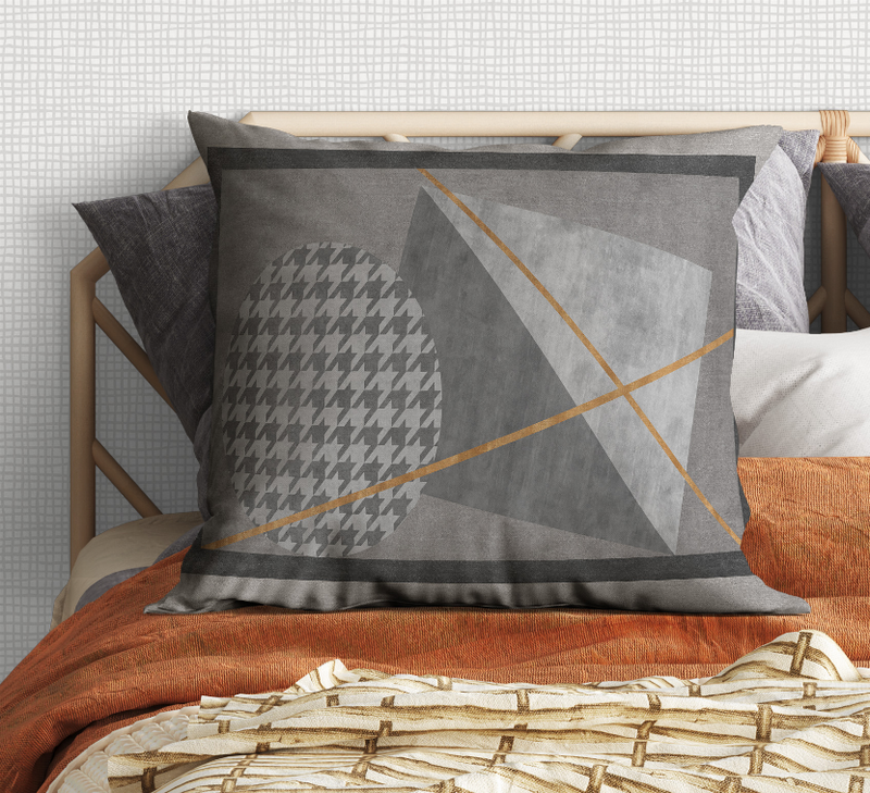 Charcoal geometric throw pillow with gold lines and houndstooth circle panel