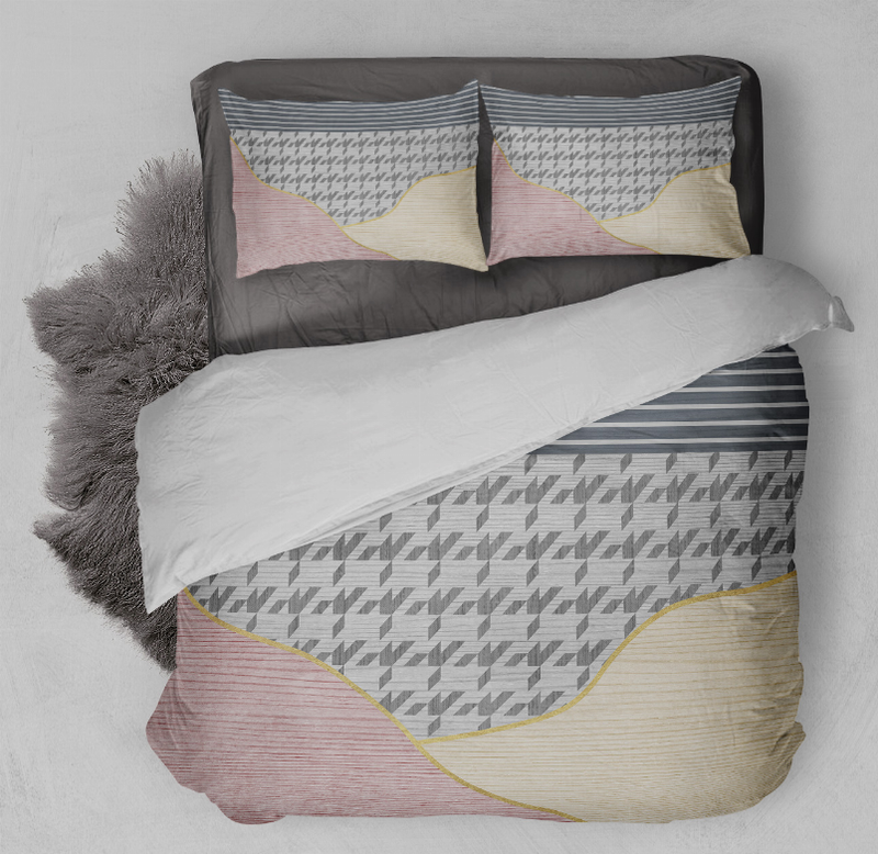 Comforter set with gray geometric print, beige and blush pink wavy accents, two shams