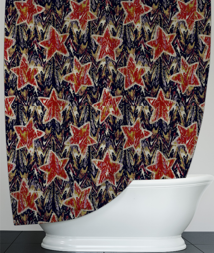 Close-up shower curtain fabric with red stars and navy zigzag accents, curved bottom