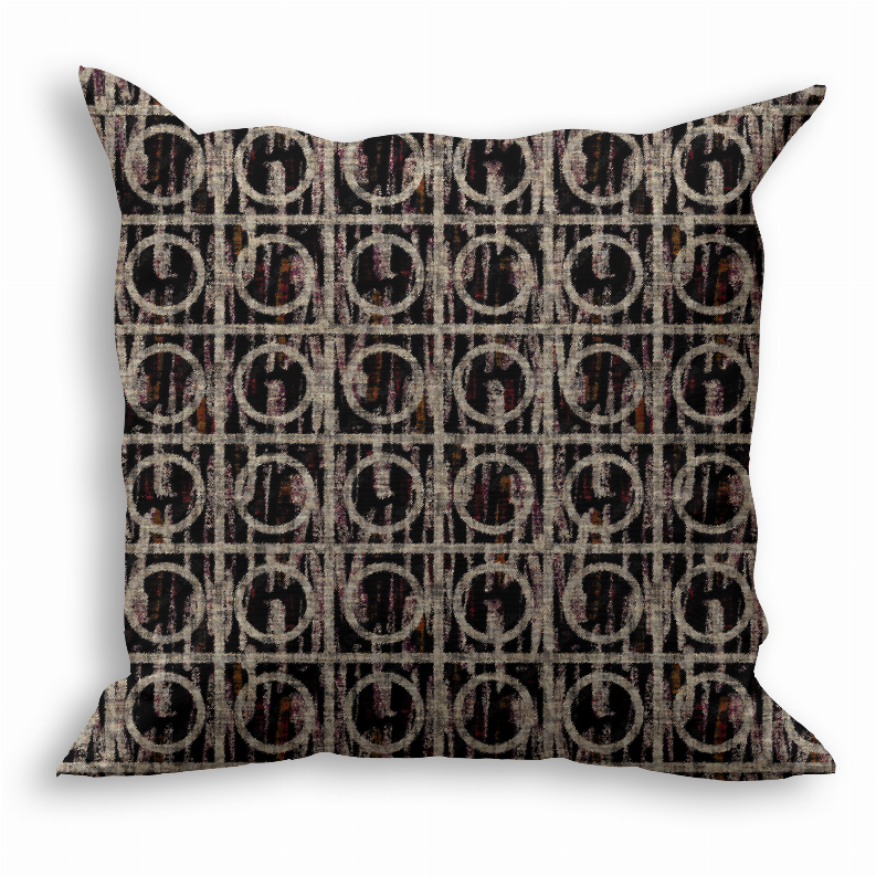 Square throw pillow with black circular monogram pattern on gray-beige fabric.