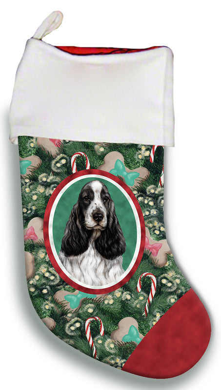 Christmas stocking with oval black-and-white dog portrait on green floral print, red cuff