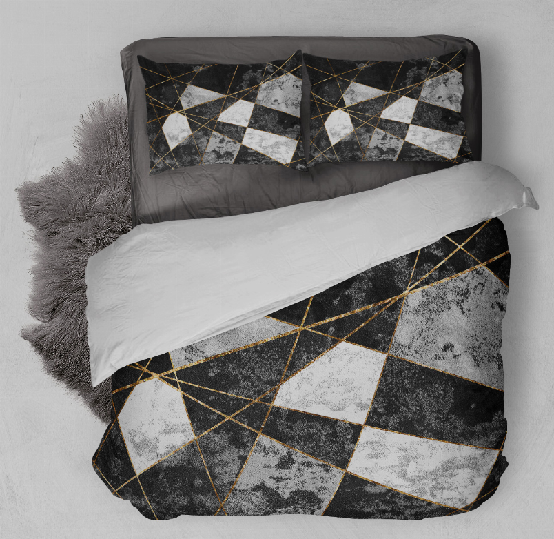 Geometric comforter set with black, gray, white blocks and gold line accents