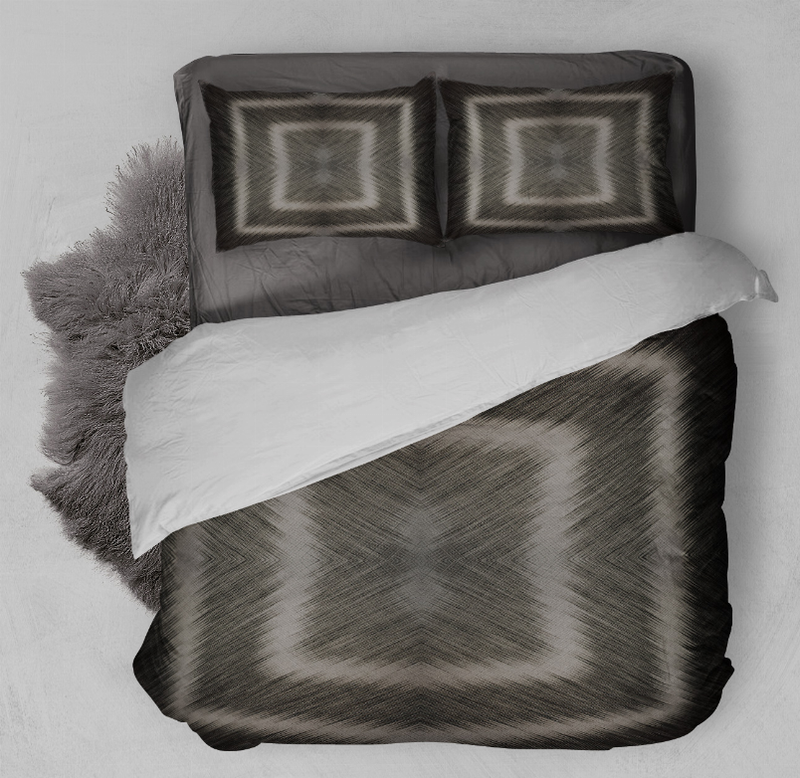 Duvet cover set with dark gray abstract pattern, two pillow shams on bed