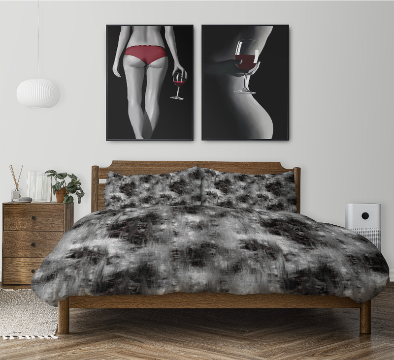Black and gray tie-dye comforter set with two pillow shams on bed