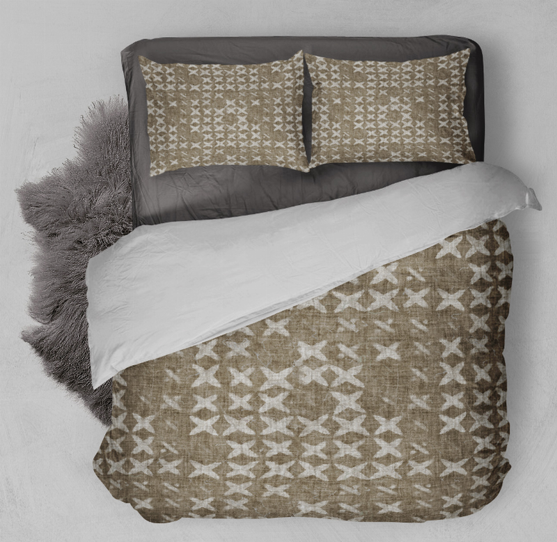 Geometric comforter set with two tan pillow shams and matching patterned cover