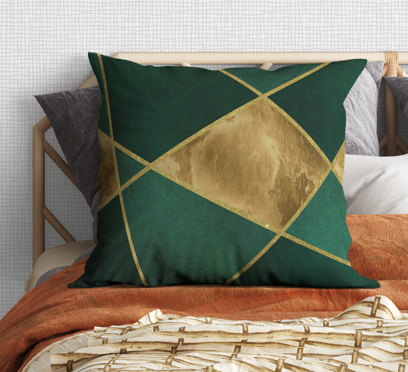 Green cushion pillow with gold diamond centerpiece and intersecting geometric borders