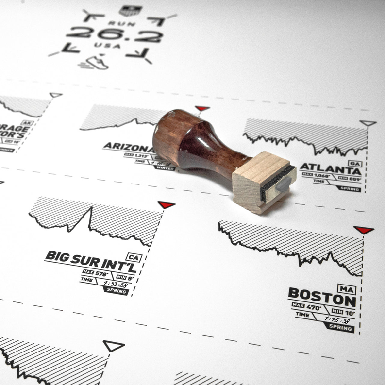 Wood ink stamp placed on marathon register print layout with city and state labels
