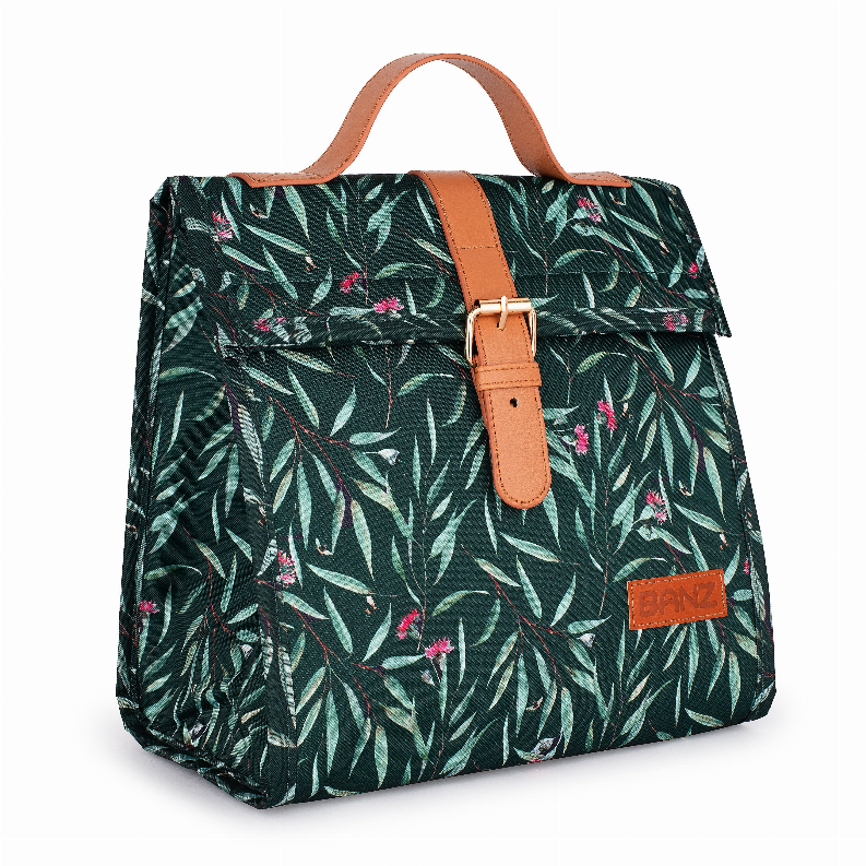 Lunch cooler bag with dark green leaf print, tan handle strap, boxy front logo patch
