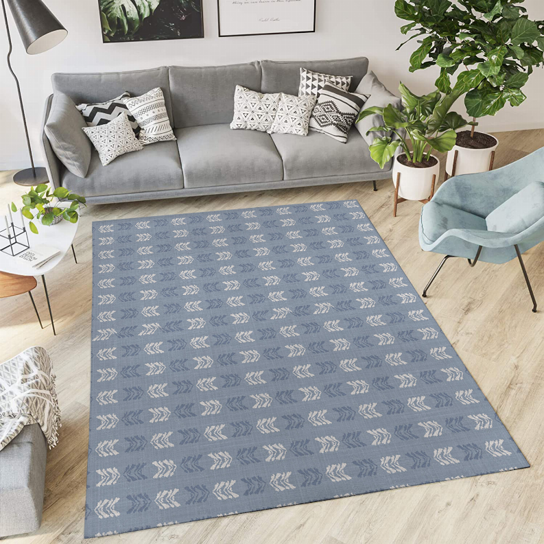 Blue low-pile area rug with repeating arrow pattern, rectangular