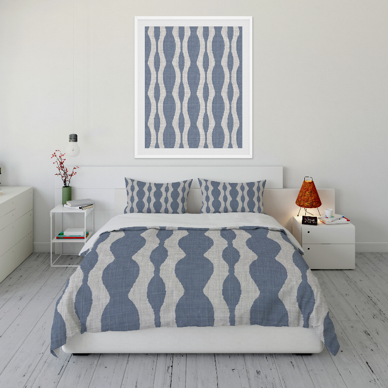 Blue and white wave-pattern comforter set on bed with two matching shams