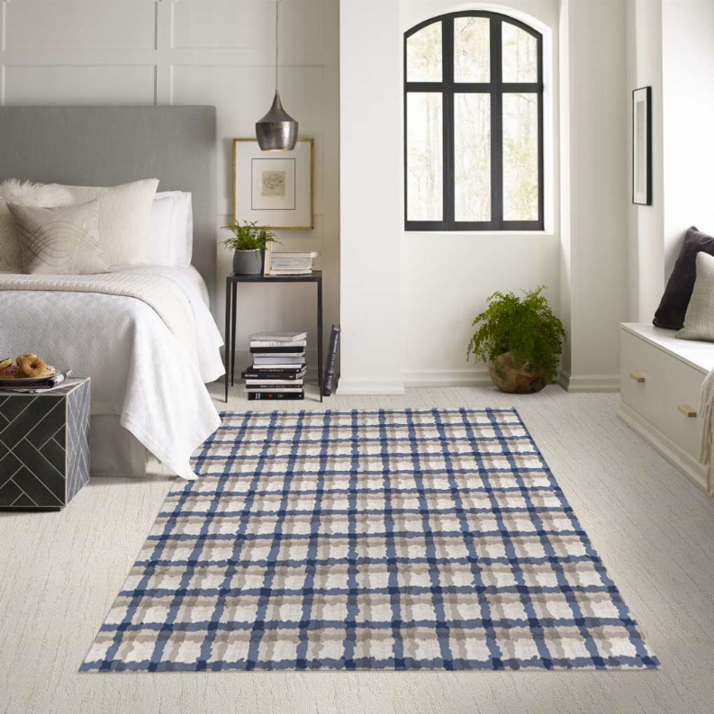 Low pile carpet rug with blue and cream checkered grid pattern, multi-color