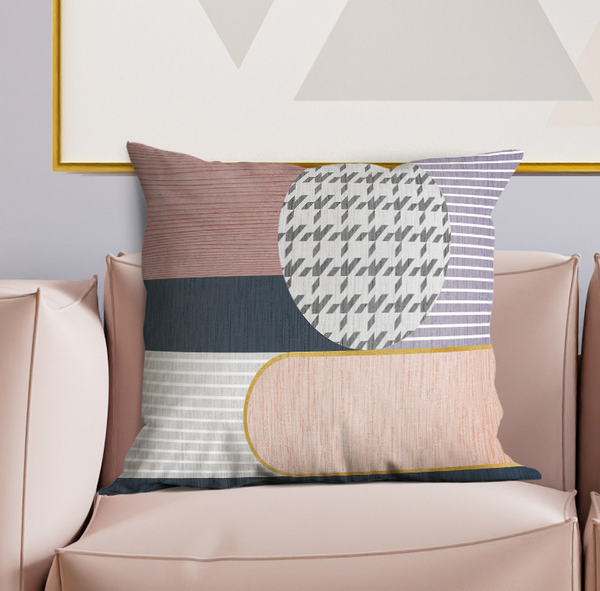 Multi-color geometric patchwork throw pillow with round medallion and striped panels