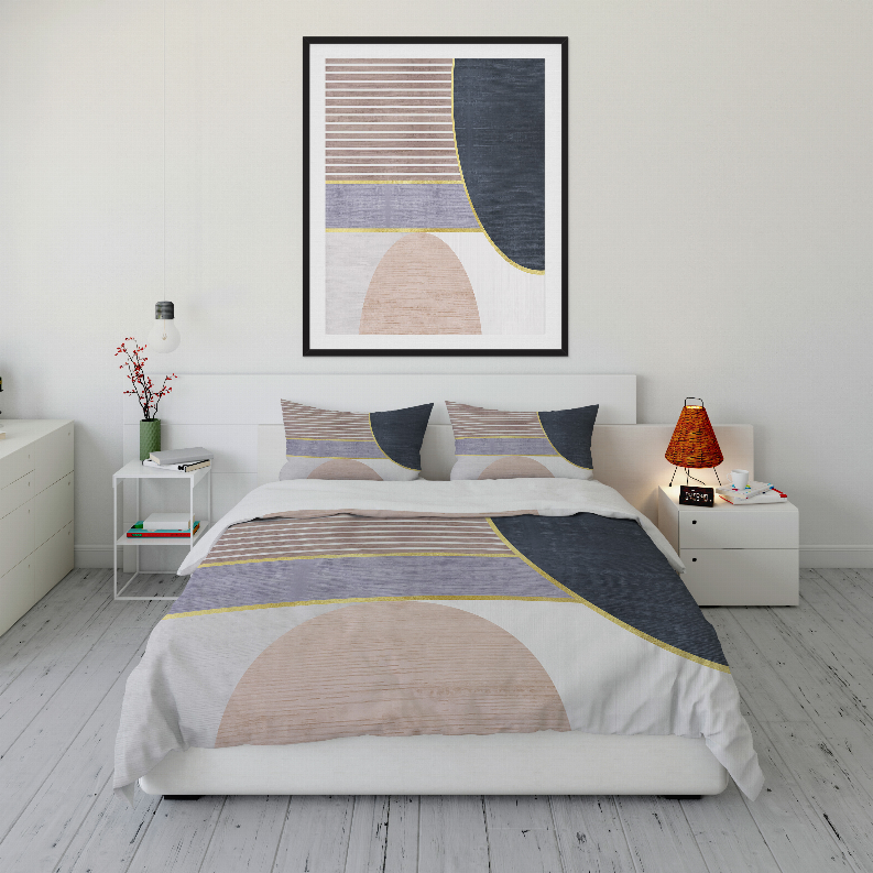 Comforter set on bed, white base with dark blue panels, yellow stripe lines, beige shapes
