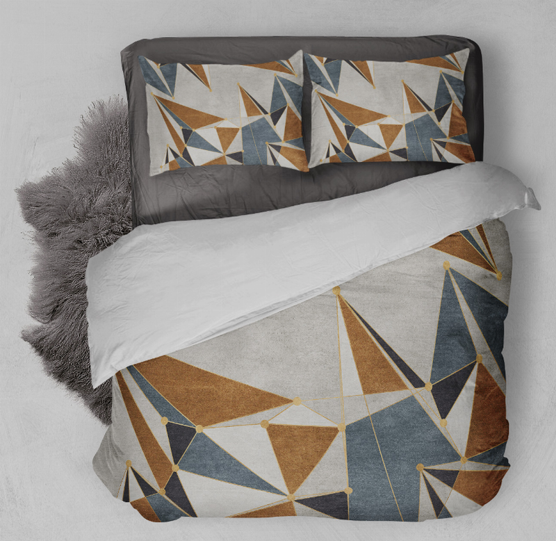 Geometric comforter set close-up with tan, blue, and white triangle and line pattern