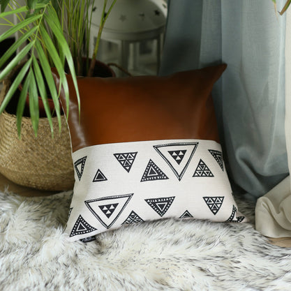 White throw pillow cover with repeating black geometric triangle pattern