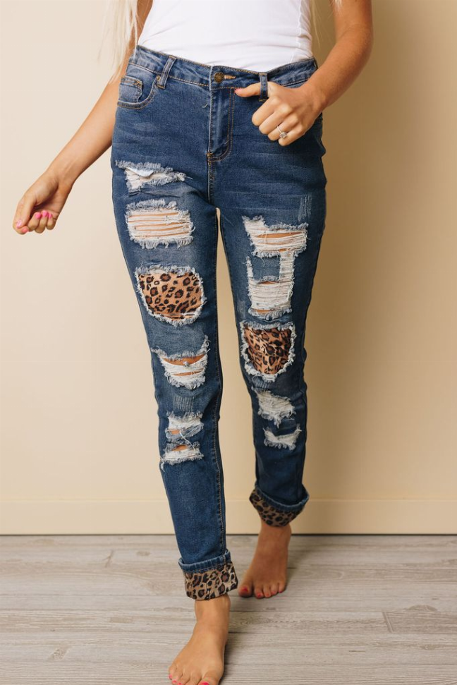Blue ripped jeans with leopard ankle cuffs and distressed thigh patches