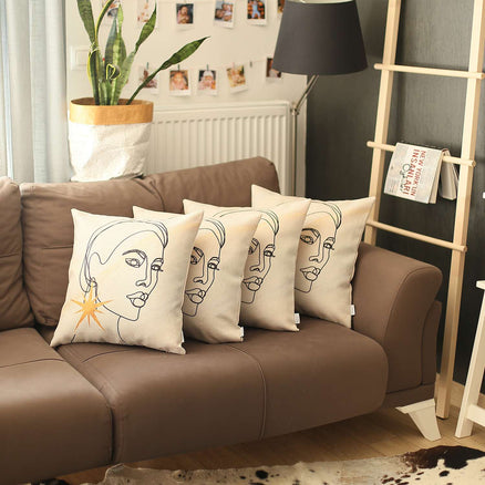 Boho face-print throw pillow covers in cream on brown sofa, set of four