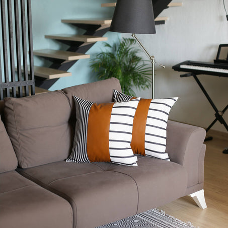 Set of 2 throw pillow covers in faux leather look: brown solid and black-white stripes
